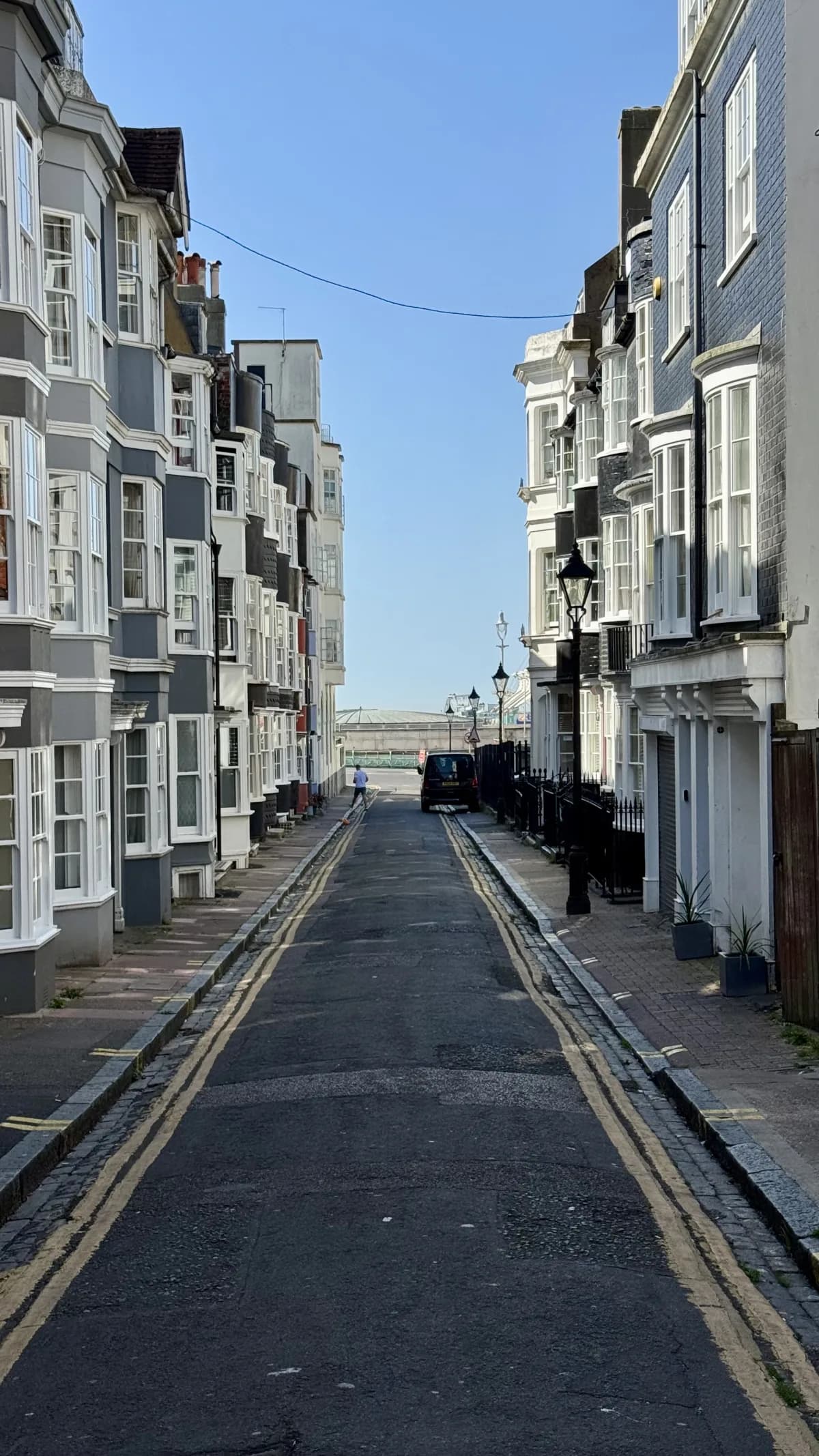 Looking down a narrow Kemptown lane towards the Palace Pier on the seafront