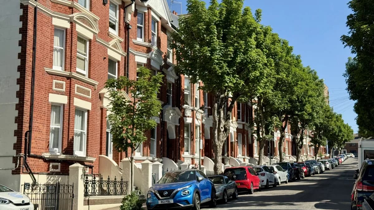 Red-brick Victorian terraces on a quiet tree-lined Kemptown side street