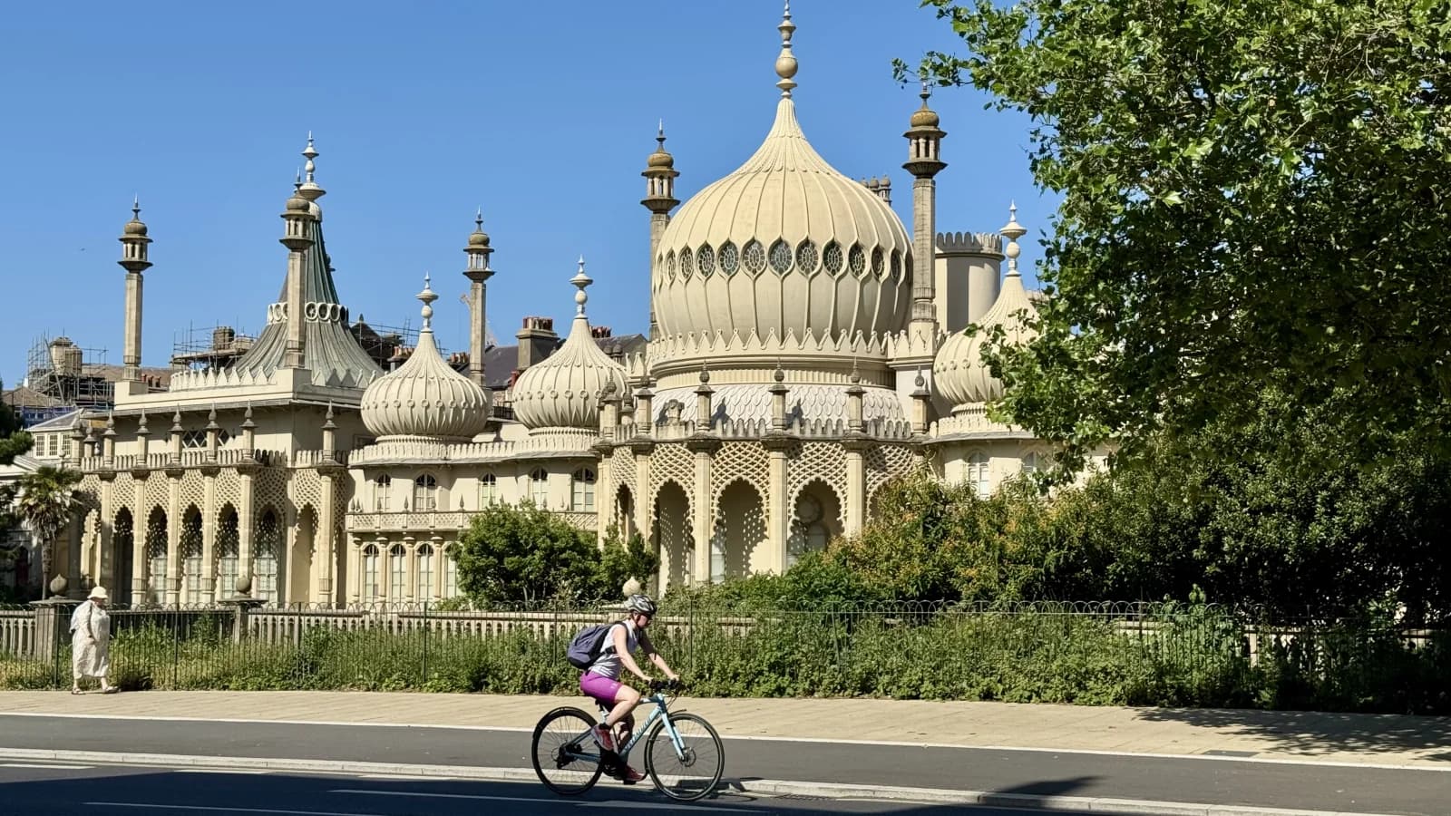 The Royal Pavilion in Brighton with a cyclist passing in front
