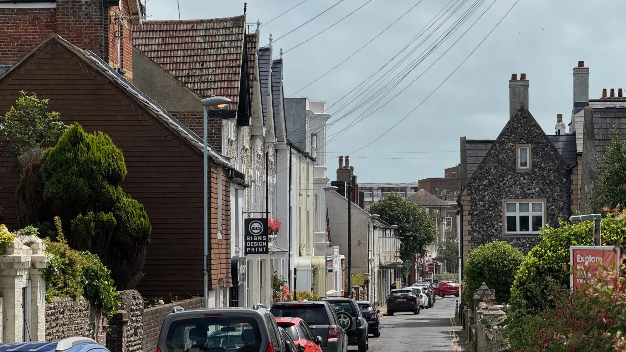 A quieter street of older flint and brick buildings in the town centre